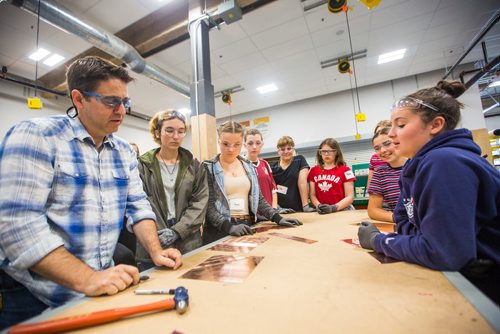 MIKAELA MACKENZIE / WINNIPEG FREE PRESS
Sheet metal instructor Luis Matias demonstrates ways to embellish copper at the Girls Exploring Trades and Technology at Red River College in Winnipeg on Tuesday, July 9, 2019. For Nadya Pankiw story.
Winnipeg Free Press 2019.