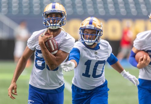 SASHA SEFTER / WINNIPEG FREE PRESS
Winnipeg Blue Bombers wide receivers Kenny Lawler (left) and Nik Demski battle for the ball during a practice at IG Field on Tuesday.
190709 - Tuesday, July 09, 2019.