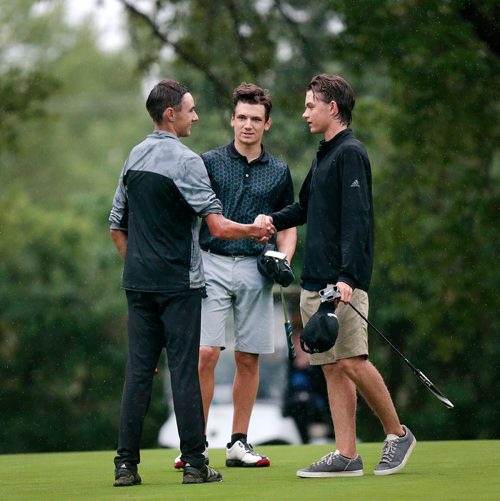 PHIL HOSSACK / WINNIPEG FREE PRESS - Left to right,  Jacob Armstrong accepts congratulations from Braxton Kuntz and Carter Johnson after taking the Manitoba Jr Men's title Tuesday at Elmhurst Golf and Country Club. Devon's story. - July 9, 2019.