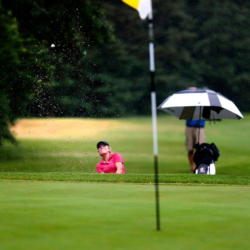 PHIL HOSSACK / WINNIPEG FREE PRESS -  Kate Gregoire chips onto the 18th green from a sand trap Manitoba Jr Women's tournament at Elmhurst Golf and Country Club Tuesday. Gregoire went on to win the women's tournament. Devon's story.- July 9, 2019.