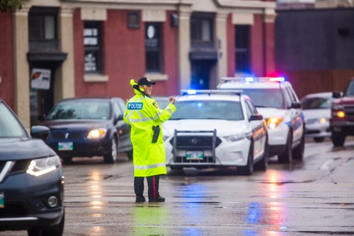 MIKAELA MACKENZIE / WINNIPEG FREE PRESS
Cadets and police direct morning traffic at Confusion Corner, where the lights have been out since 7:30pm on Tuesday, in Winnipeg on Wednesday, July 10, 2019. For Carol Sanders story.
Winnipeg Free Press 2019.