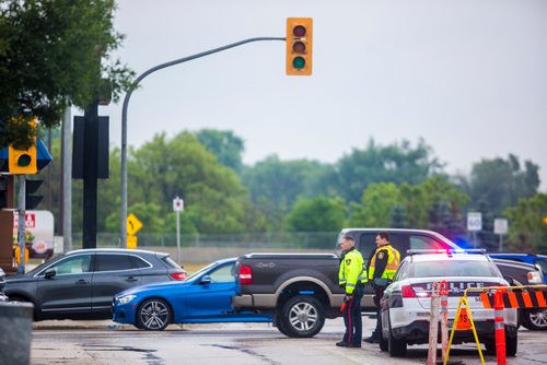 MIKAELA MACKENZIE / WINNIPEG FREE PRESS
Cadets and police direct morning traffic at Confusion Corner, where the lights have been out since 7:30pm on Tuesday, in Winnipeg on Wednesday, July 10, 2019. For Carol Sanders story.
Winnipeg Free Press 2019.