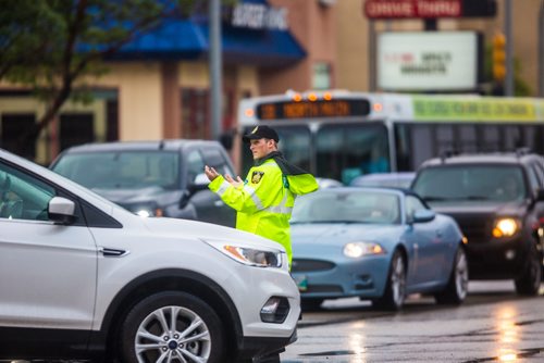 MIKAELA MACKENZIE / WINNIPEG FREE PRESS
Cadets and police direct morning traffic at Confusion Corner, where the lights have been out since 7:30pm on Tuesday, in Winnipeg on Wednesday, July 10, 2019. For Carol Sanders story.
Winnipeg Free Press 2019.