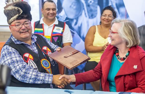 SASHA SEFTER / WINNIPEG FREE PRESS
(From left) Chief Glenn Hudson of Peguis First Nation shakes hands with Carolyn Bennett, Minister of Crown-Indigenous Relations at an event held at the urban reserve at 1075 Portage Avenue to mark the property officially becoming treaty land on Wednesday.
190710 - Wednesday, July 10, 2019.
