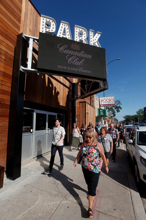 PHIL HOSSACK / WINNIPEG FREE PRESS - South Osborne Tour Guide Aaron Pridham (left) leads the first "Food Tour" down South Osborne Street. See story.  - July 10, 2019.