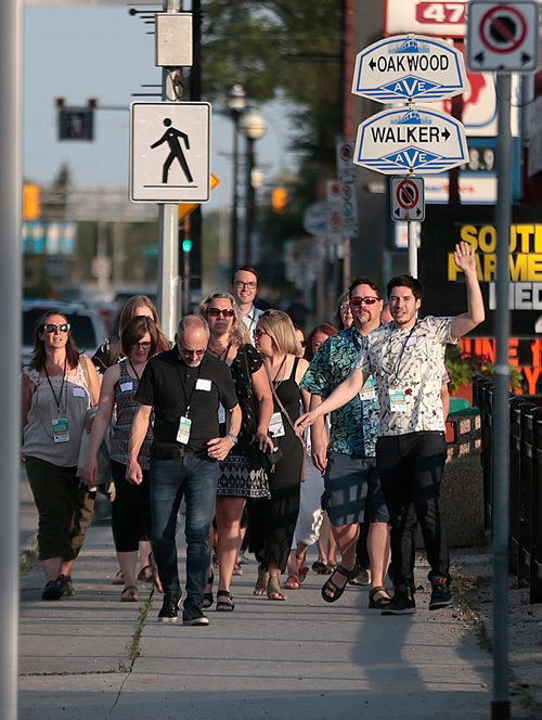 PHIL HOSSACK / WINNIPEG FREE PRESS - South Osborne Tour Guide Aaron Pridham (right) leads the first "Food Tour" down South Osborne Street. See story.  - July 10, 2019.