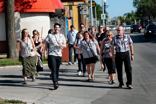 PHIL HOSSACK / WINNIPEG FREE PRESS - South Osborne Tour Guide Aaron Pridham (centre left in white top) leads the first "Food Tour" down South Osborne Street. See story.  - July 10, 2019.