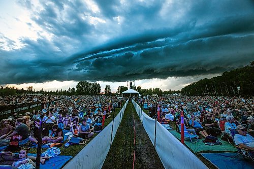 PHIL HOSSACK / WINNIPEG FREE PRESS - Folk Festival- Festival goers seemed oblivious to threatening clouds Thursday evening waiting for the final act " Death Cab for Cutie" who's performance was eventually shut down due to lightning. - July 11, 2019.
