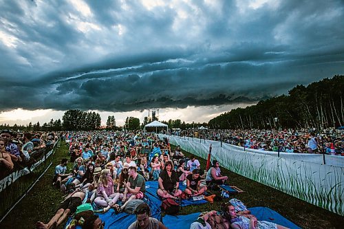 PHIL HOSSACK / WINNIPEG FREE PRESS - Folk Festival- Festival goers seemed oblivious to threatening clouds Thursday evening waiting for the final act " Death Cab for Cutie" who's performance was eventually shut down due to lightning. - July 11, 2019.