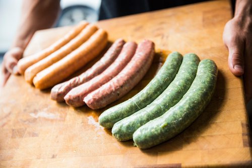 MIKAELA MACKENZIE / WINNIPEG FREE PRESS
Green chorizo (right), supreme deluxe pizza sausage, and buffalo chicken sausage at Miller's Meats in Winnipeg on Friday, July 12, 2019.
Winnipeg Free Press 2019.