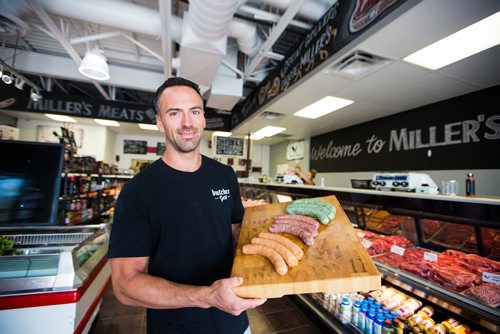 MIKAELA MACKENZIE / WINNIPEG FREE PRESS
Shawn Miller, owner of Miller's Meats, poses for a portrait in their River East location in Winnipeg on Friday, July 12, 2019.
Winnipeg Free Press 2019.