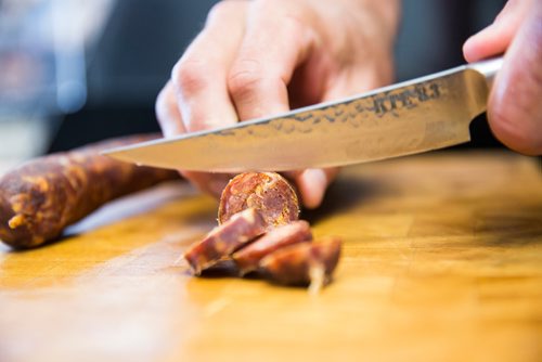 MIKAELA MACKENZIE / WINNIPEG FREE PRESS
Shawn Miller, owner of Miller's Meats, cuts into some Hungarian sausage at the River East location in Winnipeg on Friday, July 12, 2019.
Winnipeg Free Press 2019.