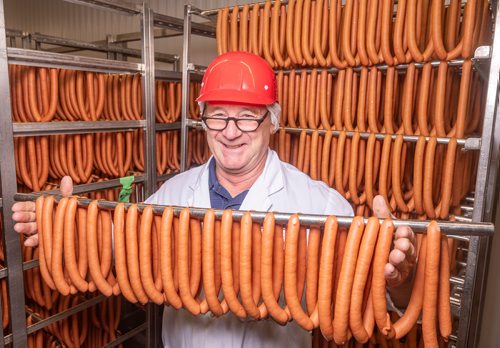 SASHA SEFTER / WINNIPEG FREE PRESS
Owner of Winnipeg Old Country Sausage Ken Werner stands with some of the 24,000 "world-famous wieners" the company produces daily at their facility in Dufferin.
190712 - Friday, July 12, 2019.