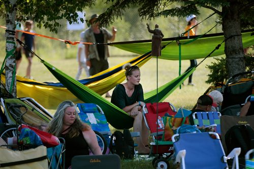 PHIL HOSSACK / WINNIPEG FREE PRESS - Folk Festival- Made in the shade, festival goers take shelter from the sun Friday afternoon. - July 11, 2019.