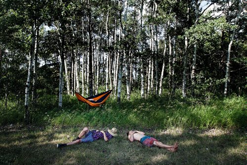 PHIL HOSSACK / WINNIPEG FREE PRESS - Afternoon after the night before, festival goers recoup and regroup Friday afternoon recovering and waiting in the shade for the evenings festivities. See story. - July 11, 2019.