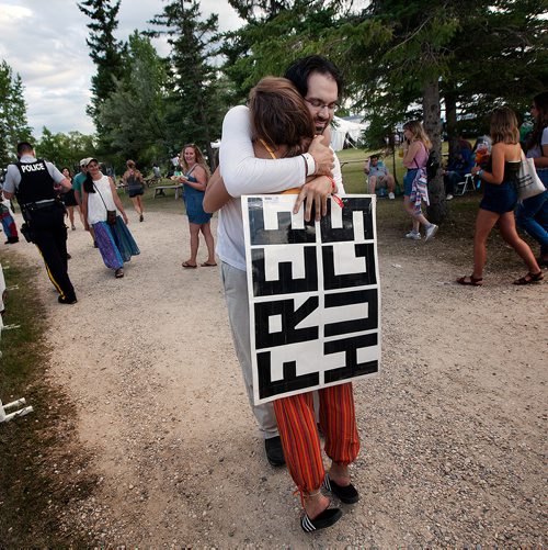 PHIL HOSSACK / WINNIPEG FREE PRESS - Folk Festival -  Free Hug Vendor Greg Allan distributes his wares among festival goers Friday. Greg's been a fixture at the festival in the last few years.
- July 12, 2019.