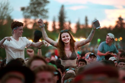 PHIL HOSSACK / WINNIPEG FREE PRESS - Folk Festival- Dancers got a leg up on the shoulders of friends in front of the main stage in the 'Dance Area" Friday night as the sun set on the Winnipeg Folk Festival.- July 11, 2019.