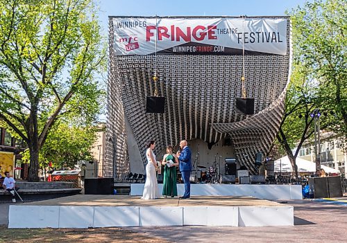 SASHA SEFTER / WINNIPEG FREE PRESS
Cathy-Anne Cook marries Justin Randall Metzger in a ceremony held in front of the Cube in the Exchange District during the Fringe Festival, where they first met two years ago.
190719 - Friday, July 19, 2019.