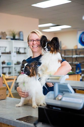 MIKAELA MACKENZIE / WINNIPEG FREE PRESS
Tegan Jacobs, co-owner of Jacobs Trading, poses with pups Vinny (top) and Valentino at the pet-friendly store in Winnipeg on Tuesday, July 23, 2019. For Tessa Vanderhart story.
Winnipeg Free Press 2019.