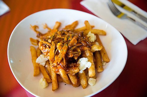 MIKAELA MACKENZIE / WINNIPEG FREE PRESS
K&S Island Grill jerk chicken poutine in Winnipeg on Tuesday, July 23, 2019. For Dave Sanderson story.
Winnipeg Free Press 2019.