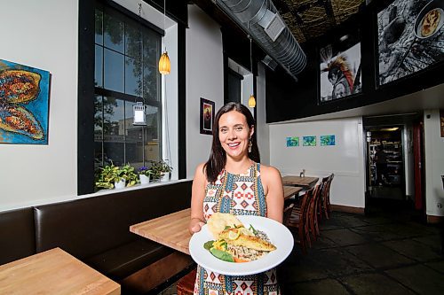 Mike Sudoma / Winnipeg Free Press

Feast Café owner, Christa Bruneau-Guenther shows off her pickerel dinner, a very popular choice on the menu.
190716 - Tuesday, July 16, 2019.