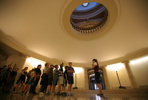 Brandon Sun Grade 5/6 students from Earl Oxford school line up to here their echo in the centre of the Pool of the Black Star at the centre of the Manitoba Legislature during a year-end field trip on Wednesday morning. The circular opening in the ceiling lines up directly under the domed roof which the Golden Boy stands guard. SEE OTHER PIC (Bruce Bumstead/Brandon Sun)