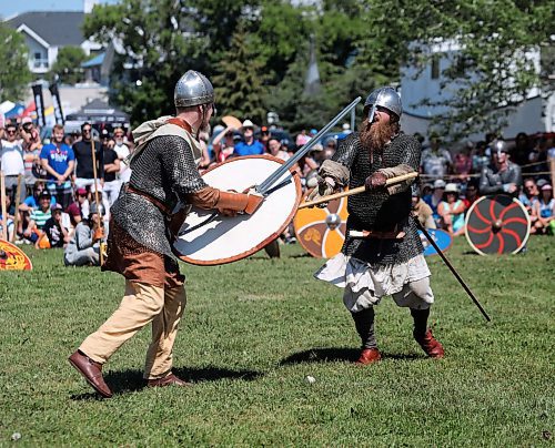 RUTH BONNEVILLE /  WINNIPEG FREE PRESS 

Gimli  Icelandic Festival 

Performers wear heavy armour including  medieval Chain Mail, wool undershirts and metal helmets in the heat as they battle each other in staged fight shows in front of onlookers on Harbour Hill in Gimli Saturday afternoon.  

An historical Viking encampment with a wide range of viking displays including, wood carvings, weaving and cooking techniques were on display in Viking village populated by dozens of reenactors who depict typical scenes from Viking culture throughout the centuries on Harbour Hill Saturday. 

The event is put on by Icelandic Festival of Manitoba and organized by members of The Vikings-Vinland.

James Melbourne (right, long beard), suito name is Badger, wears 30 - 40 pounds of fighting gear as does staged fights in front of the crowds Saturday. 


See Sol's story. 

Aug 2nd,  2019 
