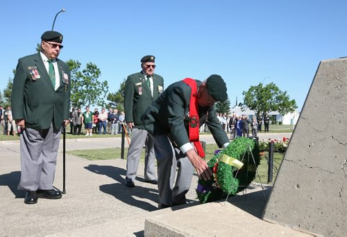 Brandon Sun 28062009 Dave Lucas, Sgt. at Arms for the Korea Veterans Association, is flanked by KVA President Peter Ewasiuk and fellow member David White as he lays a wreath at the Canoe River Memorial on Royal Ave. at CFB Shilo during a memorial service on Sunday morning. The service was part of the Royal Regiment of Canadian Artillery 2009 reunion which included veterans from WWII, the Korean War and more recent conflicts and peace keeping missions in Europe, the Middle East and Africa, as well as members of the public. (Tim Smith/Brandon Sun)