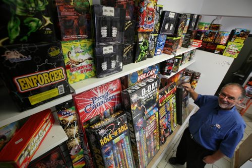 Brandon Sun Bob Freeman shows the shelves of fireworks as the Hi-Way Esso gears up for Canada Day, Monday afternoon. FOR COLLEEN STORY (Colin Corneau/Brandon Sun)