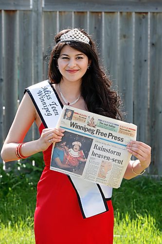 BORIS.MINKEVICH@FREEPRESS.MB.CA BORIS MINKEVICH / WINNIPEG FREE PRESS  090629 Anjali Maharij Sandhu poses for a photo with an old Free Press that she was in when she was a baby.