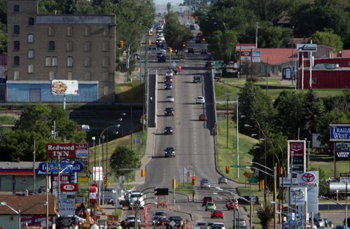 Brandon Sun 29062009 Traffic makes it's way over the Daly Overpass on 18th St. in Brandon on Monday evening. (Tim Smith/Brandon Sun)