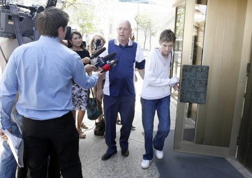 MIKE.APORIUS@FREEPRESS.MB.CA Parents Monty and Bonny Anderson leave the Law Courts Tuesday after their son Daniell was sentenced to 14 years in prison for shooting at police officers in 2006.  July 21/2009  WINNIPEG FREE PRESS