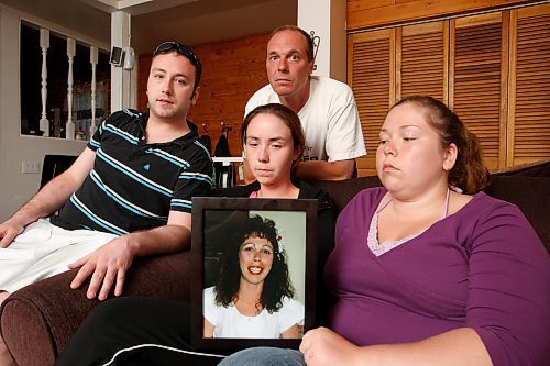 BORIS MINKEVICH / WINNIPEG FREE PRESS  090727 Jim Stewart, Ryan Labelle, Ashley Labelle, and Vanessa Robert pose for a photo. They pose with a photo of Cheryl Robert, murder shooting victim.