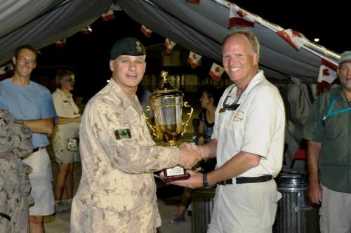 "Mr. Bill Pigden, PSP Welfare Manager accepts the 1st Kandahar Open Trophy from Colonel Roch Lacroix, Deputy Commander - Joint Task Force Afghanistan" I also notice that Bill took those photos from our common drive without mentioning appropriate credit.  Proper credit to MCpl Jonathan Johansen, Task Force Kandahar Public Affairs. FOR WINNIPEG FREE PRESS