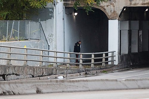 MIKE DEAL / WINNIPEG FREE PRESS
Evidence markers line the northbound lane of Main Street at the Higgins underpass just south of Sutherland Avenue early Wednesday morning after a pedestrian was killed around midnight.
The northbound lane of Main Street is expected to be closed for some time according to police. 
191016 - Wednesday, October 16, 2019.
