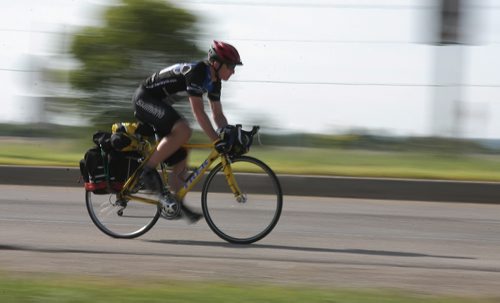 Brandon Sun Ben Verboom of Ajax, Ont., pedals his way along the Trans-Canada Highway as he departed Brandon for Moosomin, Sask., during his cross-country Cycle to Help for suicide awareness on Wednesday morning. Verboom's inspiration for his ride came from his father, who battled depression before taking his own life in 2004. Verboom's father, an avid cyclist, had aways wanted to make a cross-Canada trip with his son, Ben, who now rides his father's bike in his memory. Funds raised by Verboom will be distributed to a variety of grassroots mental health projects across Canada. (Bruce Bumstead/Brandon Sun)