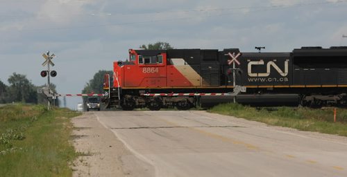 Brandon Sun A CN train crosses over Hwy. 34, north of Austin, on August 4, 2009. FOR FILES (Bruce Bumstead/Brandon Sun)