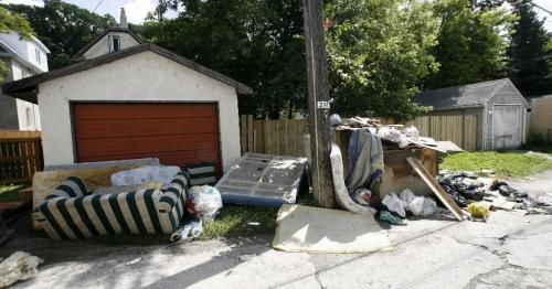 MIKE.DEAL@FREEPRESS.MB.CA 0900806 Garbage in alleys has piled up as though the collection crews were on strike in some parts of the north end. These photos were taken in the back alleys of Sherbrook and Furby, as well as on McMicken See Kevin Rollason story. WINNIPEG FREE PRESS