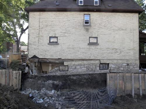 MIKE.DEAL@FREEPRESS.MB.CA 0900812 102 year-old house on Norquay where the foundation collapsed last night. Excavation next door for a new house has been underway and poor retaining support is the cause. See Aldo Santin story. WINNIPEG FREE PRESS