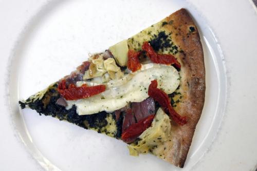 MIKE.DEAL@FREEPRESS.MB.CA 090820 Civita Restaurant A slice of the Civita Pizza cooked in a wood oven.   See David Sanderson story.  WINNIPEG FREE PRESS