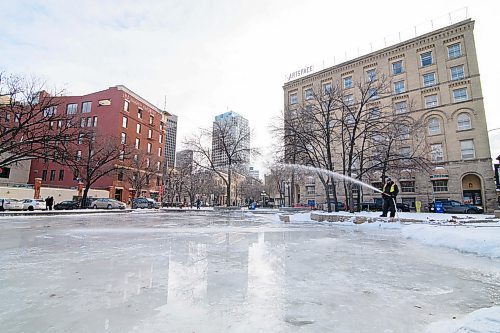Mike Sudoma / Winnipeg Free Press
City of Winnipeg employee, Bobby Swift floods the skating rink at The Cube in Old Market Square in Downtown Winnipegs Exchange District Friday afternoon
December 6, 2019