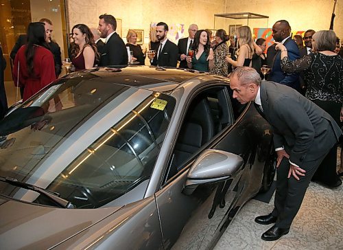 JASON HALSTEAD / WINNIPEG FREE PRESS

Guests check out auction items, including a mix of art and experiences, like this Porsche one lucky winner won for a weekend at the Winnipeg Art Gallery (WAG) Gala Ball on Oct. 19, 2019. (See Social Page)