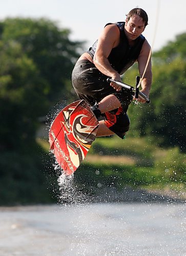 BORIS.MINKEVICH@FREEPRESS.MB.CA BORIS MINKEVICH / WINNIPEG FREE PRESS  090823 Martin Antoniak gets some air wakeboarding on the Red River.