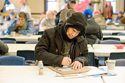 Mike Sudoma / Winnipeg Free Press
Roland, a guest at Wednesday afternoons Oak Table program hosted in the Augustine United Church building, works on some of his artwork after getting some lunch.
December 11, 2019