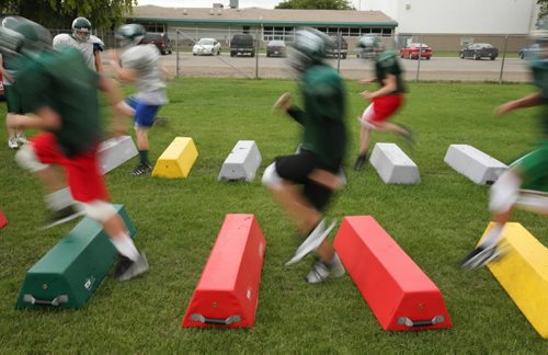 Brandon Sun Players speed past in an agility drill during a Neelin Spartans football practice, Monday evening. (Colin Corneau/Brandon Sun)