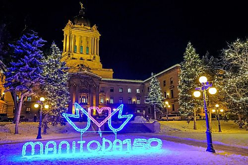 Daniel Crump / Winnipeg Free Press. The Manitoba Legislature is lit up to celebrate Manitoba 150 on Saturday evening. December 14, 2019.