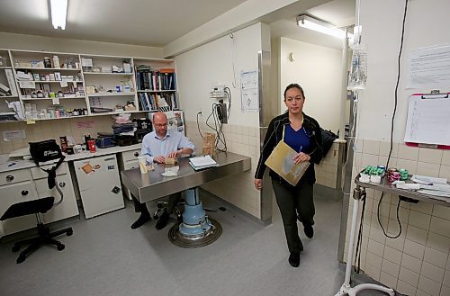 SHANNON VANRAES / WINNIPEG FREE PRESS
Dr. Chelsea Lim walks into a multipurpose room at the Winnipeg Animal Emergency Hospital on Saturday, December 14, 2019, as Dr. David Scammell takes a quick dinner break. The animal hospital is open 24-hours a day, 365 days a year.
