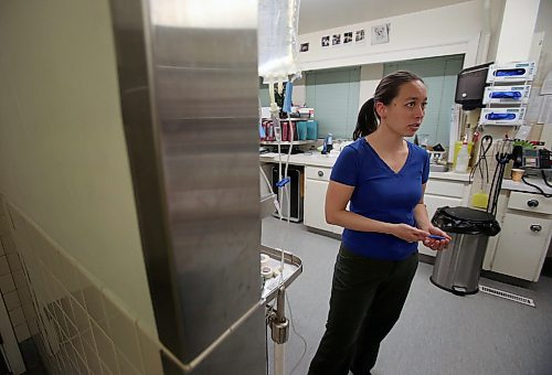 SHANNON VANRAES / WINNIPEG FREE PRESS
Dr. Chelsea Lim speaks to a colleague while working an overnight shift at the Winnipeg Animal Emergency Hospital's pharmacy on December 14, 2019. The animal hospital is open 24-hours a day, 365 days a year.