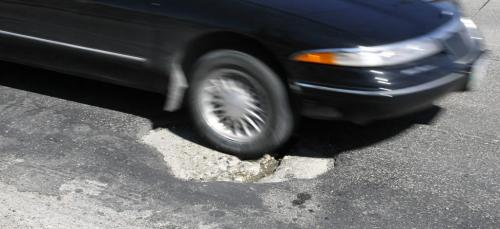 MIKE.DEAL@FREEPRESS.MB.CA 090825 A large pothole on South bound Route 90. See Bartley Kives story.  WINNIPEG FREE PRESS