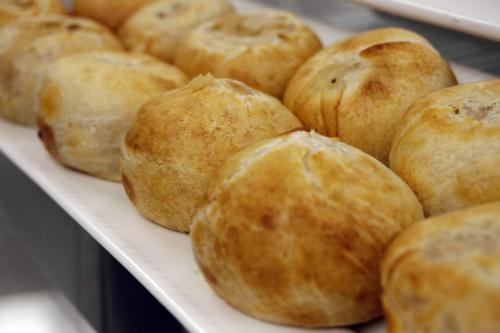 MIKE.DEAL@FREEPRESS.MB.CA 090826 Restaurant review - Desserts Plus Barbara Reiss in her store Desserts Plus on Corydon Ave. with (l-r) knishes, potato latkes and chicken pot pie. WINNIPEG FREE PRESS